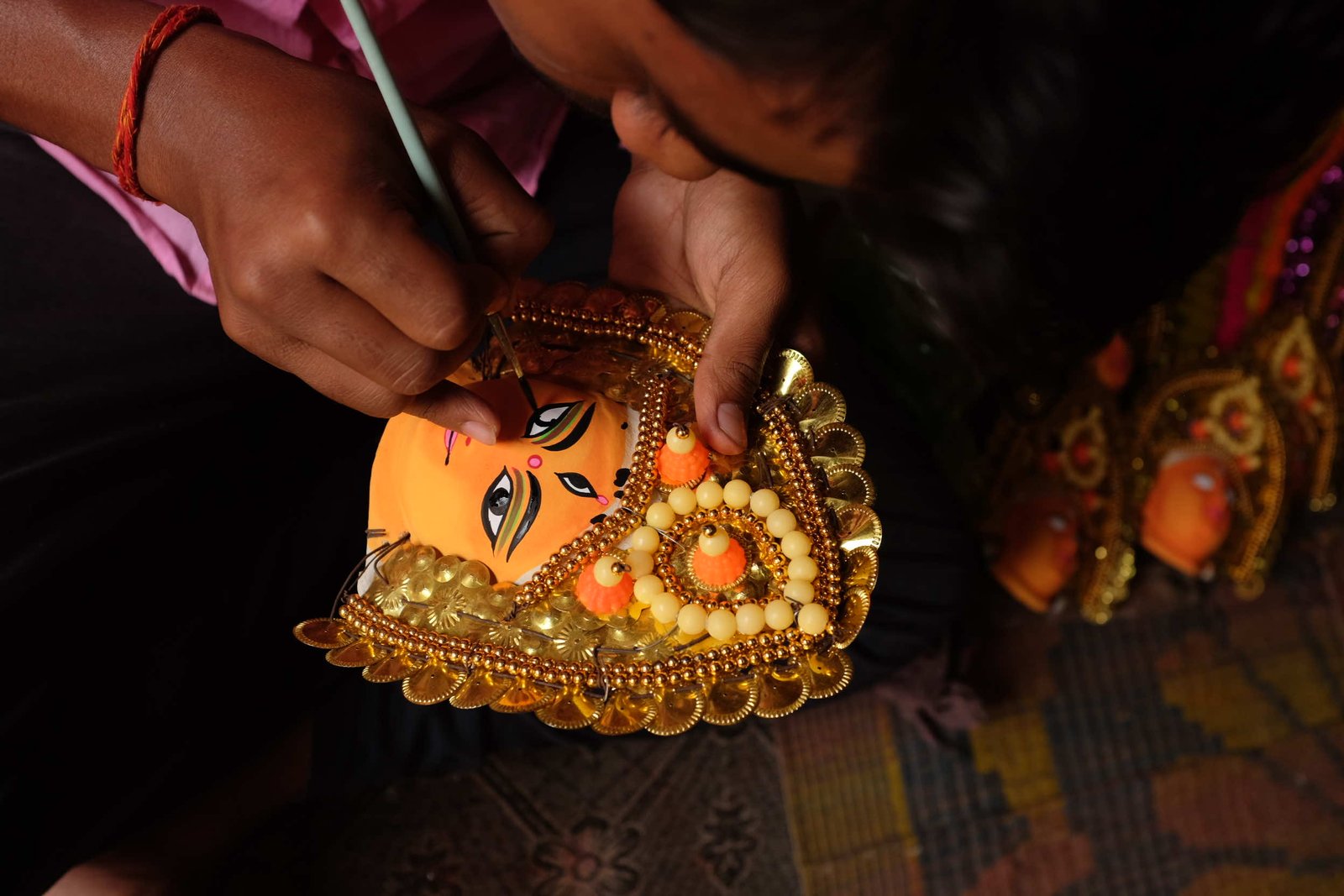 Chhau mask artisan in Charida village creating traditional mask