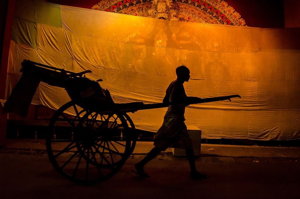 Bitumen to Pixels: A Photographer’s Chemical Romance 3 Hand-pulled rickshaw in North Kolkata, early morning light - Durga Puja
