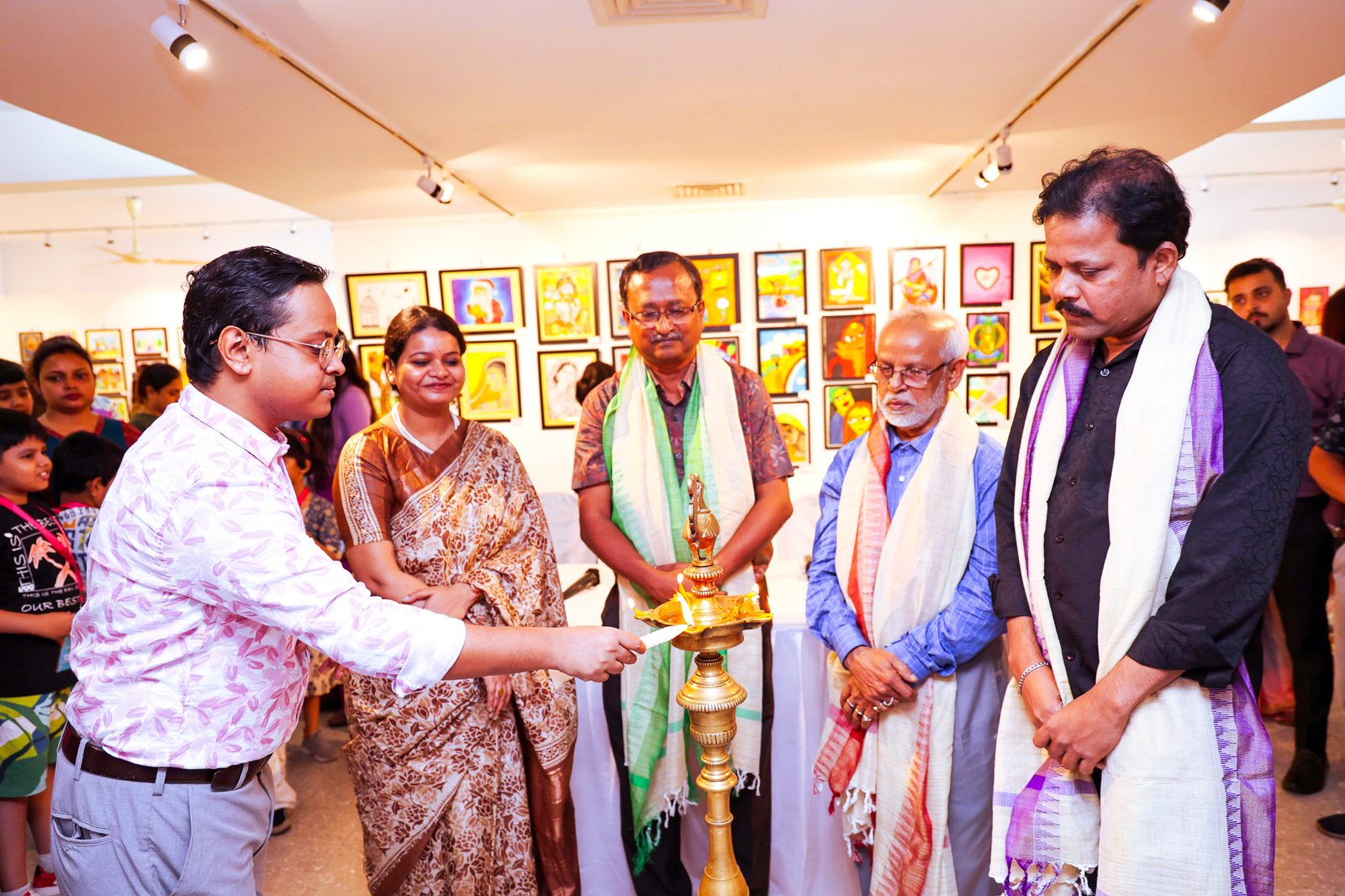 A young artist with family, proud moment after display